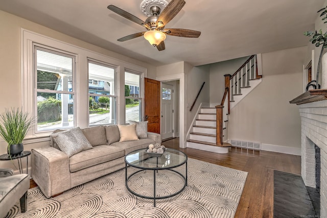 21 Orange Ter, West Haven, CT 06516 - living area with wood finished floors, stairway, a brick fireplace, and ceiling fan