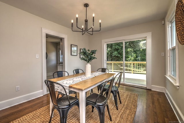 21 Orange Ter, West Haven, CT 06516 - dining space with a chandelier, dark wood-style floors, and healthy amount of natural light