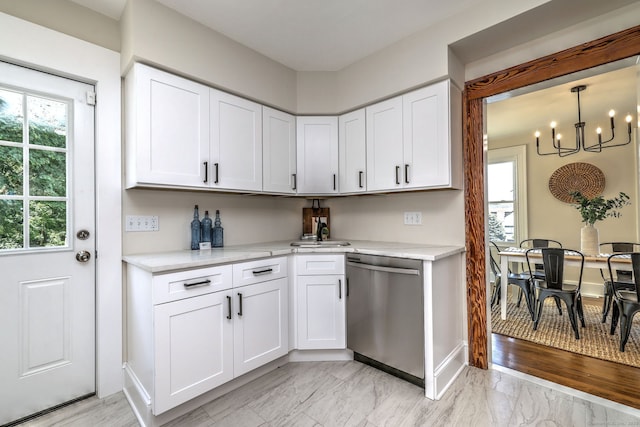 21 Orange Ter, West Haven, CT 06516 - kitchen featuring dishwasher, white cabinets, a chandelier, and light marble finish floors