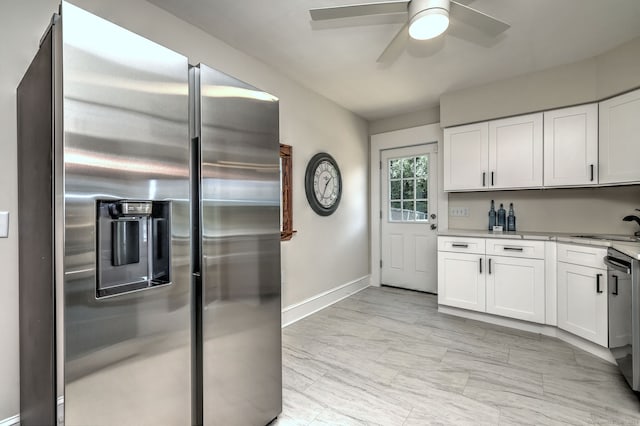 21 Orange Ter, West Haven, CT 06516 - kitchen featuring appliances with stainless steel finishes, a ceiling fan, white cabinets, and light countertops
