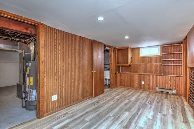 21 Orange Ter, West Haven, CT 06516 - basement with a baseboard heating unit, gas water heater, wood finished floors, wood walls, and recessed lighting