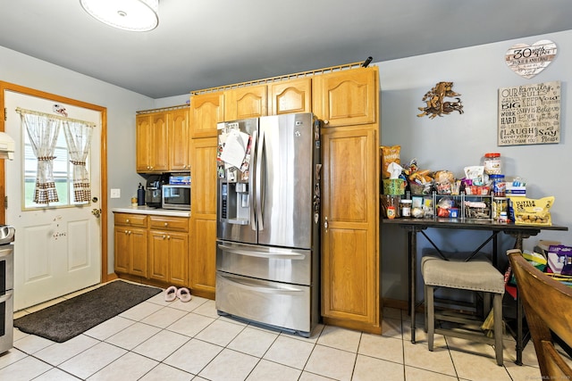 6 Topstone Dr, Danbury, CT 06810 - kitchen featuring stainless steel appliances, light tile patterned floors, and light countertops