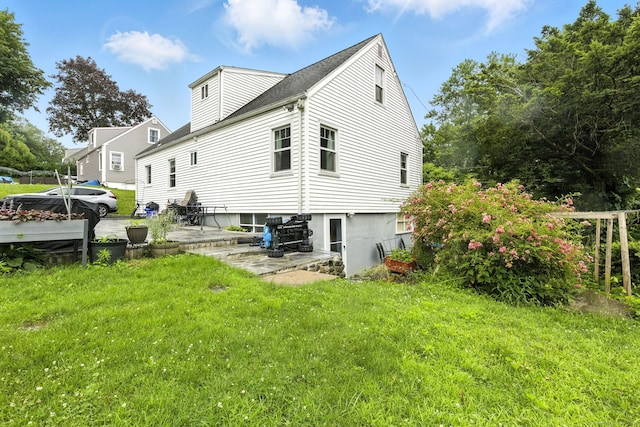 6 Topstone Dr, Danbury, CT 06810 - rear view of house with a lawn and a patio