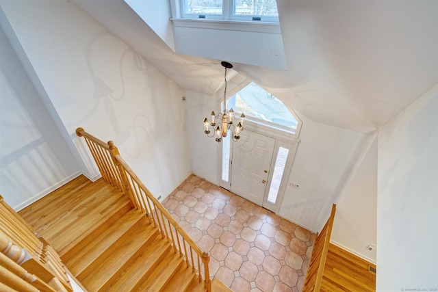 37 Skyline Dr, Groton, CT 06340 - entrance foyer with a chandelier, stairway, and light wood-style floors
