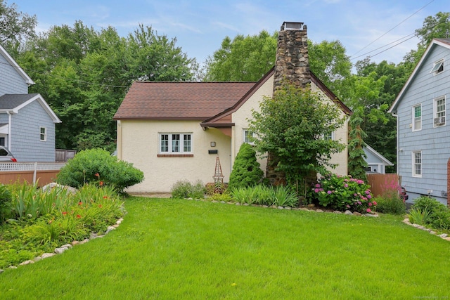 20 Cedar Crest Pl, Norwalk, CT 06854 - view of front facade with a chimney, stucco siding, and a shingled roof