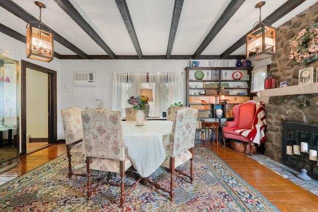 20 Cedar Crest Pl, Norwalk, CT 06854 - dining room with hardwood / wood-style floors, beamed ceiling, a fireplace, and a wall mounted AC