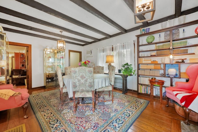 20 Cedar Crest Pl, Norwalk, CT 06854 - dining room featuring beam ceiling, wood finished floors, and a wall mounted air conditioner