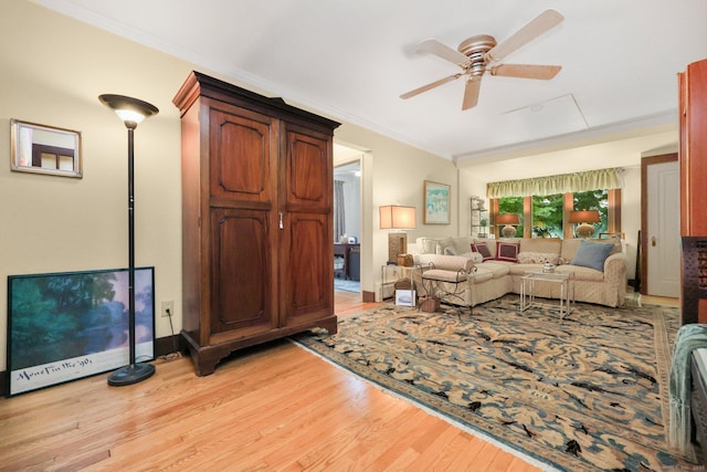 20 Cedar Crest Pl, Norwalk, CT 06854 - living room with light wood finished floors, a ceiling fan, and crown molding