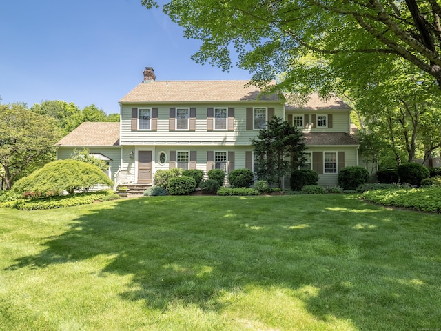51 Powderhorn Dr, Ridgefield, CT 06877 - colonial inspired home with a chimney and a front lawn