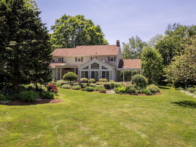 51 Powderhorn Dr, Ridgefield, CT 06877 - rear view of property with a chimney and a lawn