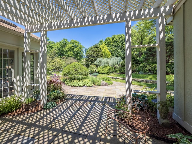 51 Powderhorn Dr, Ridgefield, CT 06877 - view of patio with a pergola and view of wooded area