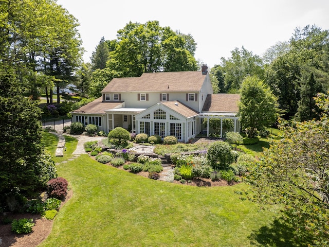51 Powderhorn Dr, Ridgefield, CT 06877 - rear view of property with a lawn and a chimney