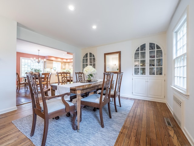 51 Powderhorn Dr, Ridgefield, CT 06877 - dining space with hardwood / wood-style floors, a chandelier, radiator heating unit, and recessed lighting