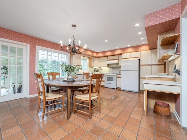 51 Powderhorn Dr, Ridgefield, CT 06877 - dining space with wallpapered walls, a chandelier, light tile patterned floors, and recessed lighting