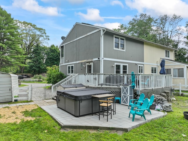 7 Pheasant Run Rd Unit 1, Kent, CT 06757 - back of property with a patio area, a wooden deck, and a hot tub