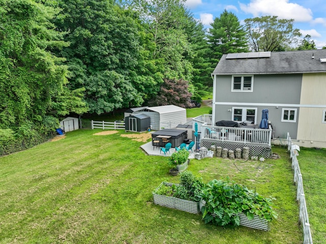 7 Pheasant Run Rd Unit 1, Kent, CT 06757 - fenced backyard featuring a storage unit, a vegetable garden, and a wooden deck