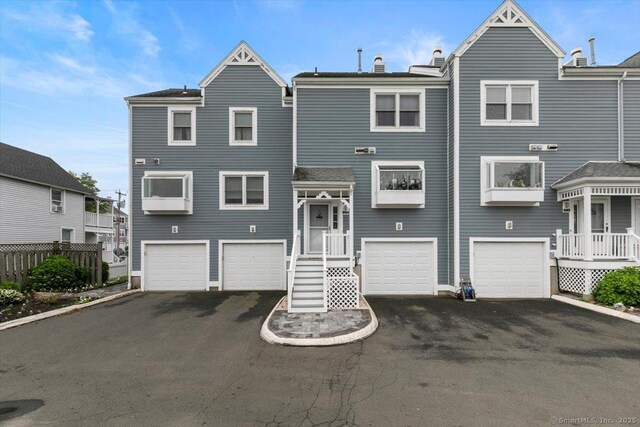 93 Cosey Beach Ave Apt 5, East Haven, CT 06512 - multi unit property featuring driveway, a garage, and a chimney
