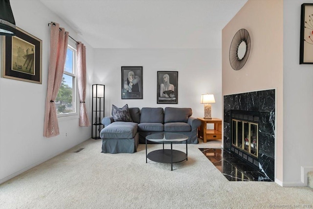 93 Cosey Beach Ave Apt 5, East Haven, CT 06512 - carpeted living room featuring a premium fireplace