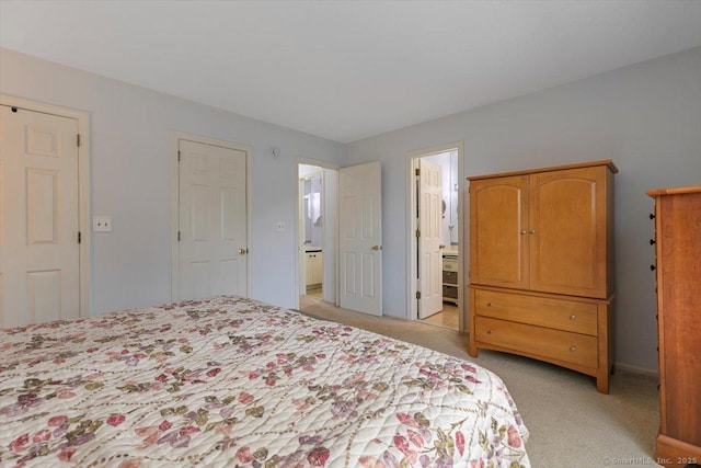 93 Cosey Beach Ave Apt 5, East Haven, CT 06512 - bedroom with light colored carpet and ensuite bathroom