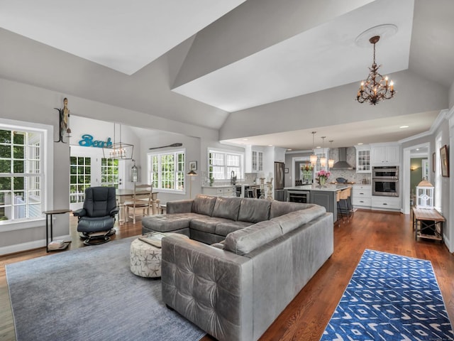 14 Ely Ln, Killingworth, CT 06419 - living area featuring a chandelier, vaulted ceiling, and dark wood-style flooring