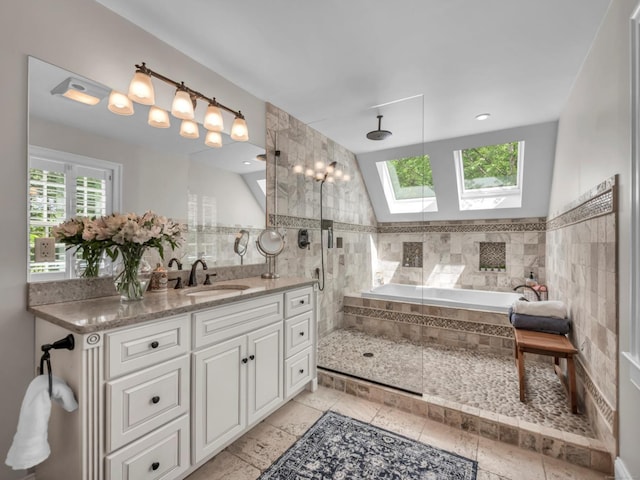 14 Ely Ln, Killingworth, CT 06419 - full bathroom featuring a skylight, tile walls, vanity, a stall shower, and tiled tub