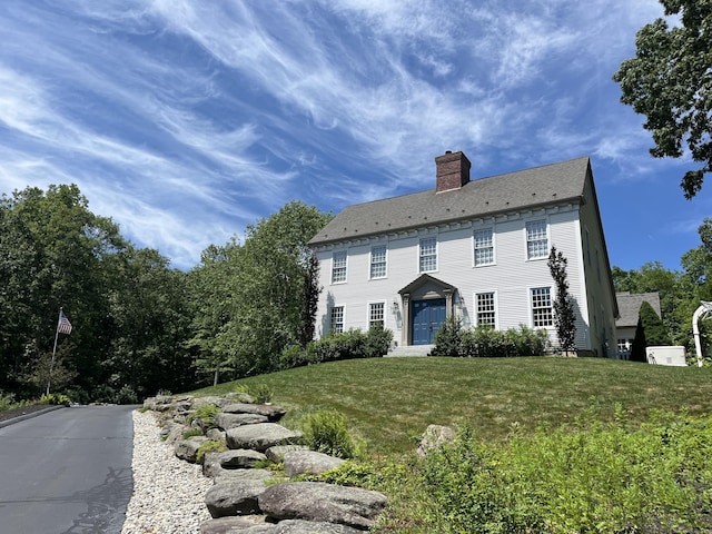 14 Ely Ln, Killingworth, CT 06419 - colonial house featuring a chimney and a front lawn