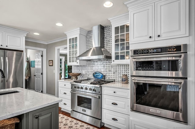 14 Ely Ln, Killingworth, CT 06419 - kitchen featuring appliances with stainless steel finishes, wall chimney exhaust hood, ornamental molding, white cabinetry, and recessed lighting