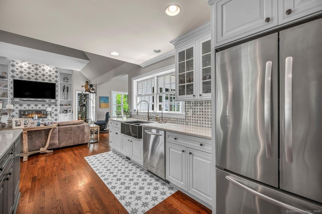 14 Ely Ln, Killingworth, CT 06419 - kitchen featuring appliances with stainless steel finishes, open floor plan, light countertops, glass insert cabinets, and recessed lighting