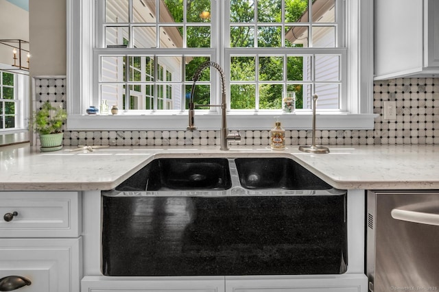 14 Ely Ln, Killingworth, CT 06419 - kitchen with dishwasher, backsplash, white cabinetry, and plenty of natural light