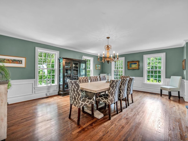 14 Ely Ln, Killingworth, CT 06419 - dining area with a chandelier, ornamental molding, wood finished floors, wainscoting, and a decorative wall