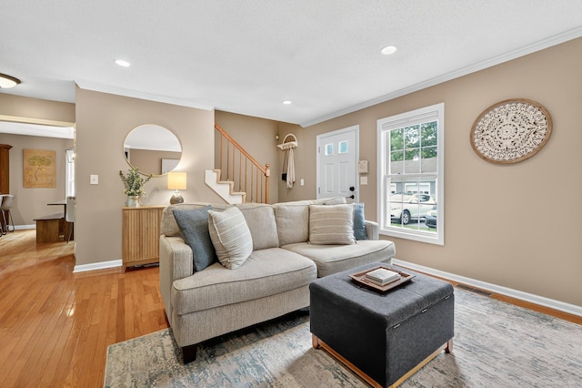 215 Georgetown Dr, Glastonbury, CT 06033 - living area featuring ornamental molding, light wood-style floors, recessed lighting, and stairs