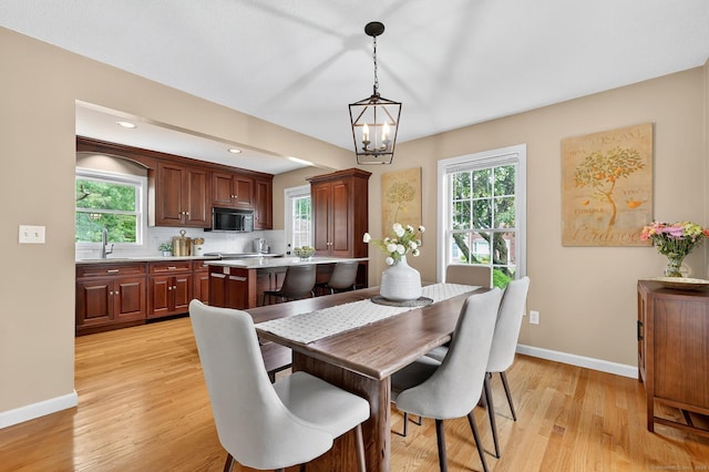 215 Georgetown Dr, Glastonbury, CT 06033 - dining room with light wood-style flooring, healthy amount of natural light, a chandelier, and recessed lighting