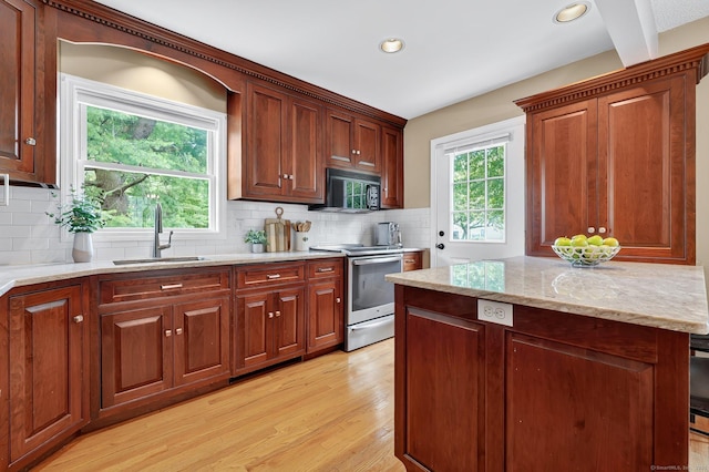 215 Georgetown Dr, Glastonbury, CT 06033 - kitchen featuring stainless steel electric range oven, black microwave, light wood finished floors, tasteful backsplash, and recessed lighting