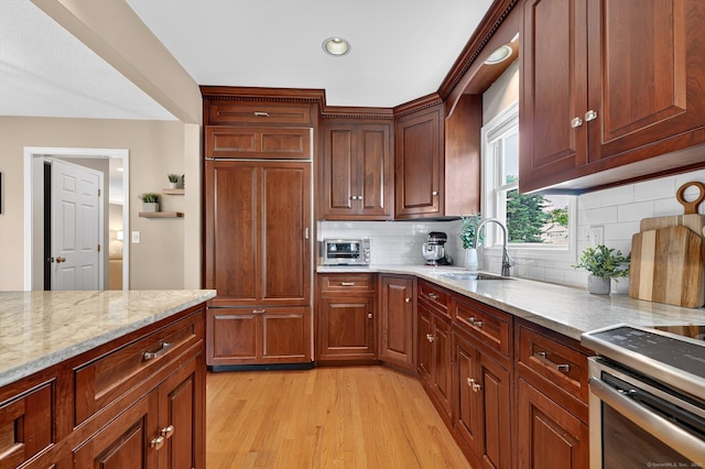 215 Georgetown Dr, Glastonbury, CT 06033 - kitchen featuring light wood-style floors, light stone countertops, stainless steel electric range, decorative backsplash, and recessed lighting