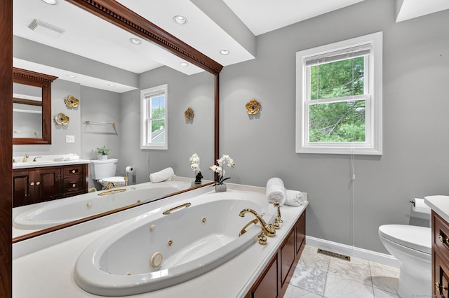 215 Georgetown Dr, Glastonbury, CT 06033 - full bathroom with vanity, marble look tiles, a jetted tub, and recessed lighting