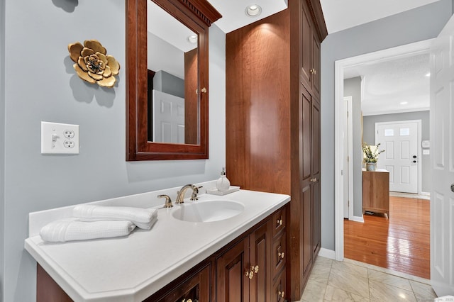 215 Georgetown Dr, Glastonbury, CT 06033 - bathroom with marble finish floors, vanity, and recessed lighting