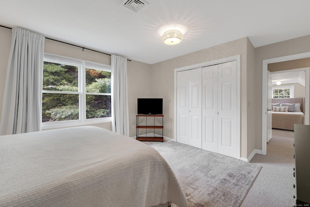 215 Georgetown Dr, Glastonbury, CT 06033 - bedroom with light colored carpet and a closet