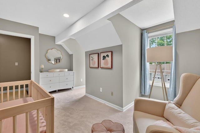 215 Georgetown Dr, Glastonbury, CT 06033 - bedroom featuring light colored carpet, lofted ceiling, and a crib
