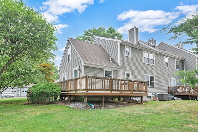 215 Georgetown Dr, Glastonbury, CT 06033 - back of house featuring a shingled roof, a chimney, a deck, and a lawn