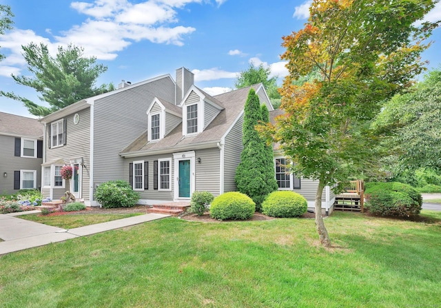 215 Georgetown Dr, Glastonbury, CT 06033 - view of front facade with a front lawn and a chimney