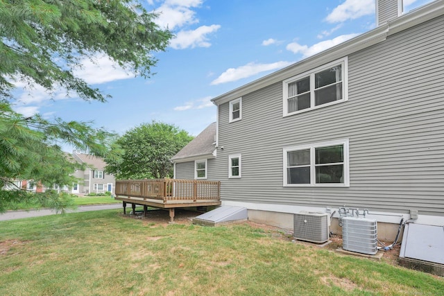 215 Georgetown Dr, Glastonbury, CT 06033 - back of house featuring a deck and a lawn