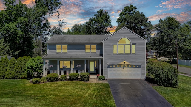 288 Pine Ln, Wethersfield, CT 06109 - traditional-style house with a garage, covered porch, asphalt driveway, and a lawn