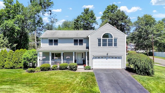 288 Pine Ln, Wethersfield, CT 06109 - traditional-style home featuring an attached garage, covered porch, driveway, and a front lawn