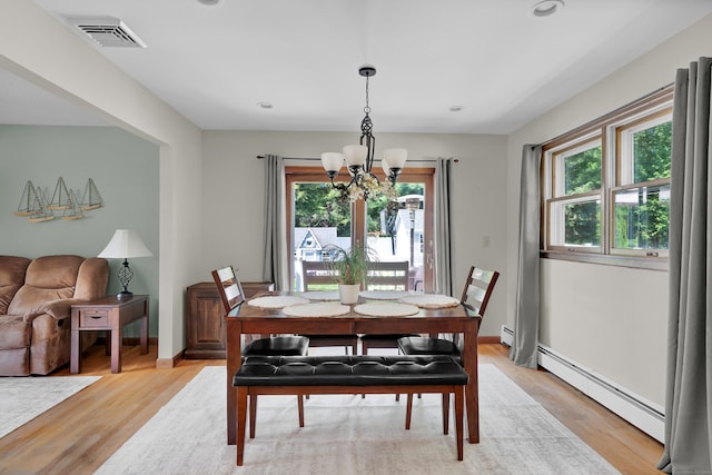 288 Pine Ln, Wethersfield, CT 06109 - dining area with a chandelier, a baseboard radiator, light wood finished floors, and recessed lighting