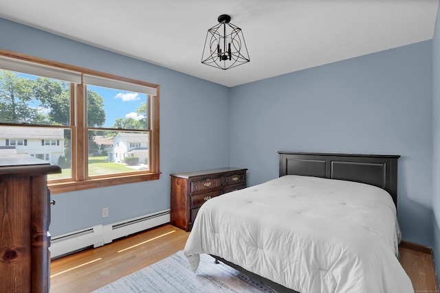 288 Pine Ln, Wethersfield, CT 06109 - bedroom with baseboard heating and wood finished floors
