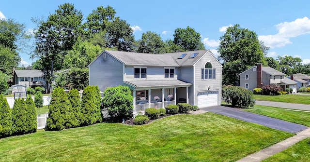 288 Pine Ln, Wethersfield, CT 06109 - traditional home featuring driveway, an attached garage, a porch, and a front yard