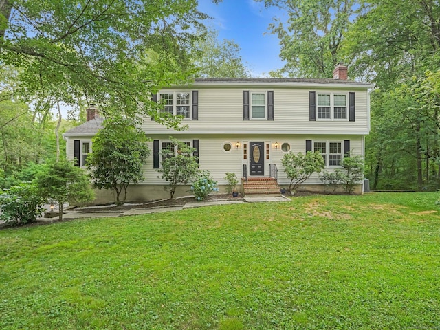 119 Deforest Rd, Wilton, CT 06897 - colonial-style house featuring a chimney, entry steps, and a front yard
