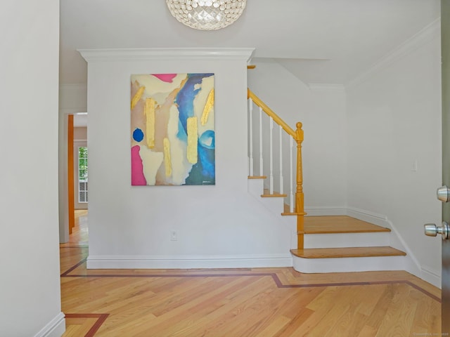 119 Deforest Rd, Wilton, CT 06897 - stairs featuring wood finished floors, crown molding, and a chandelier