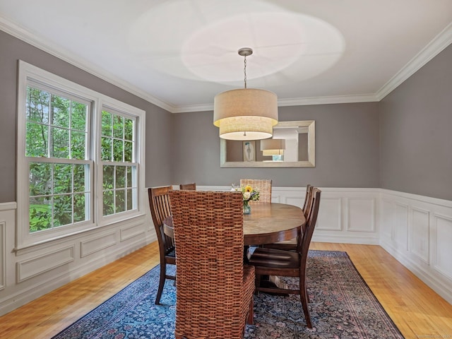 119 Deforest Rd, Wilton, CT 06897 - dining room featuring light wood-type flooring, a decorative wall, crown molding, and a wainscoted wall