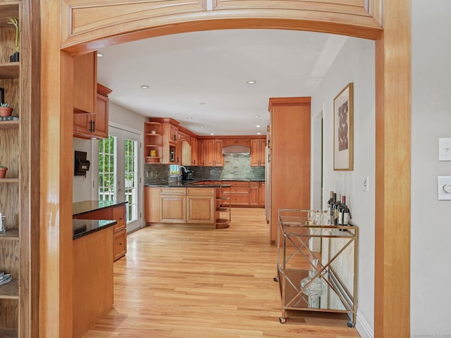 119 Deforest Rd, Wilton, CT 06897 - kitchen with open shelves, arched walkways, dark countertops, light wood-style flooring, and recessed lighting
